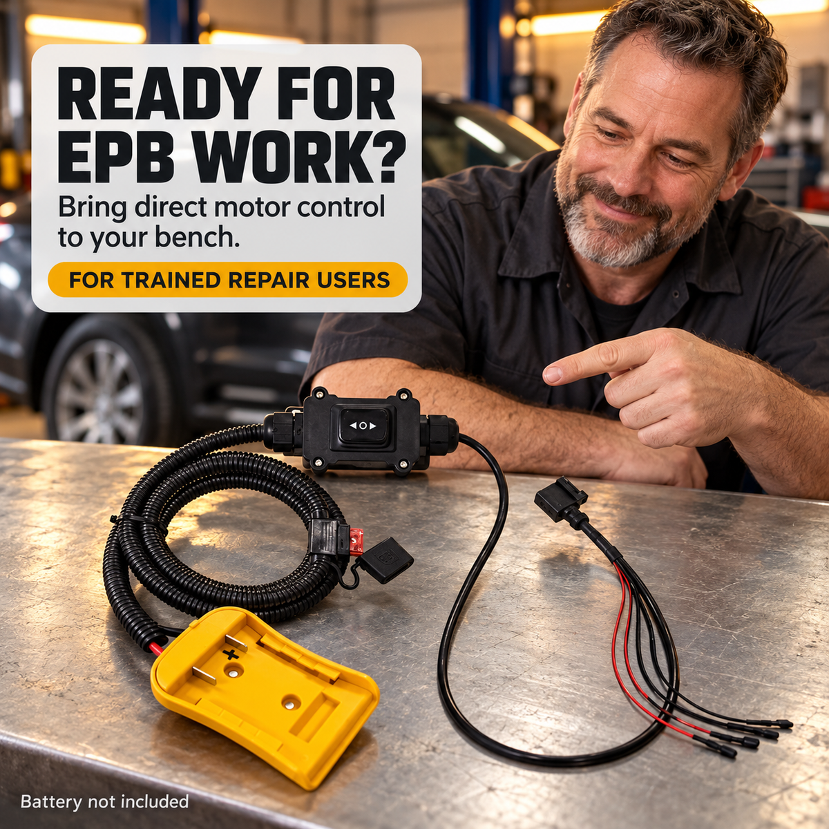 Mechanic reviewing the EPB release tool on a workshop bench