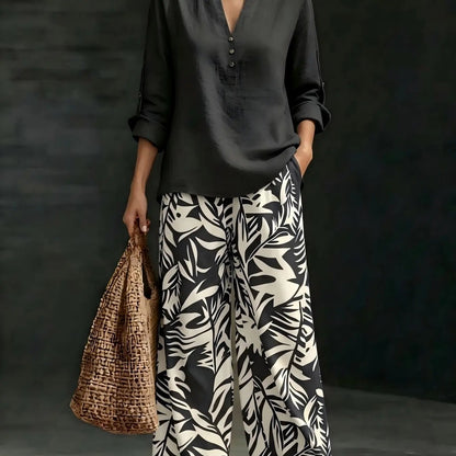 🔥Women's fashion casual two-piece set featuring a V-neck top with design details paired with wide-leg pants with a botanical pattern; comfortable and breathable, suitable for multiple occasions