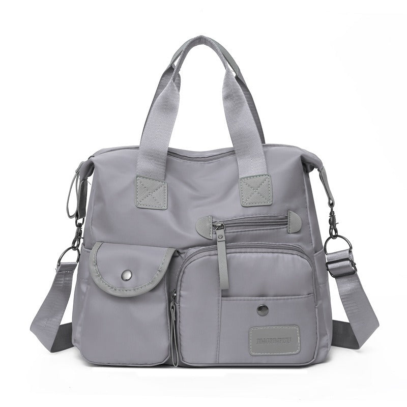🥳2026 HOT SALE🥳💞50K+ SOLD!👜🌟 50% OFF! Large Waterproof Tote Bag – Spacious main compartment, multiple pockets & 3 carrying ways. Lightweight Oxford fabric – perfect for work, shopping & travel! 💪✨